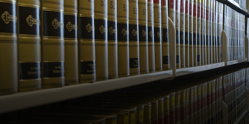 A bookshelf with legal textbooks