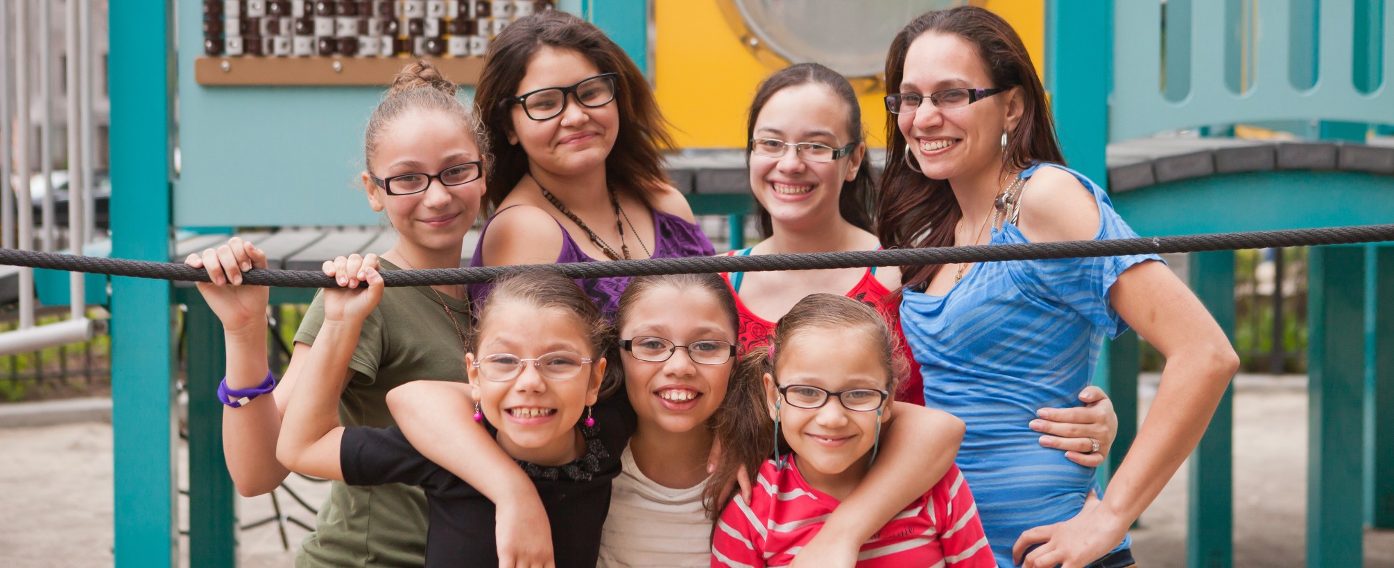 Homeless family of girls smiling