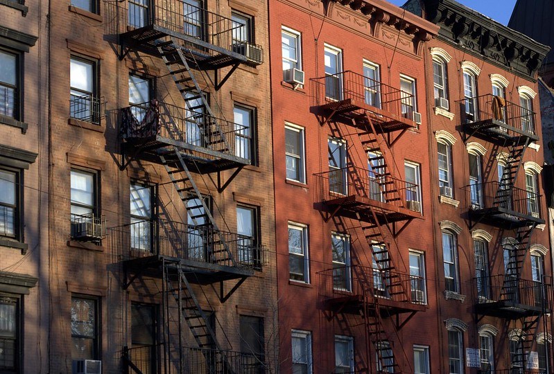 New York City brick apartments with fire escapes