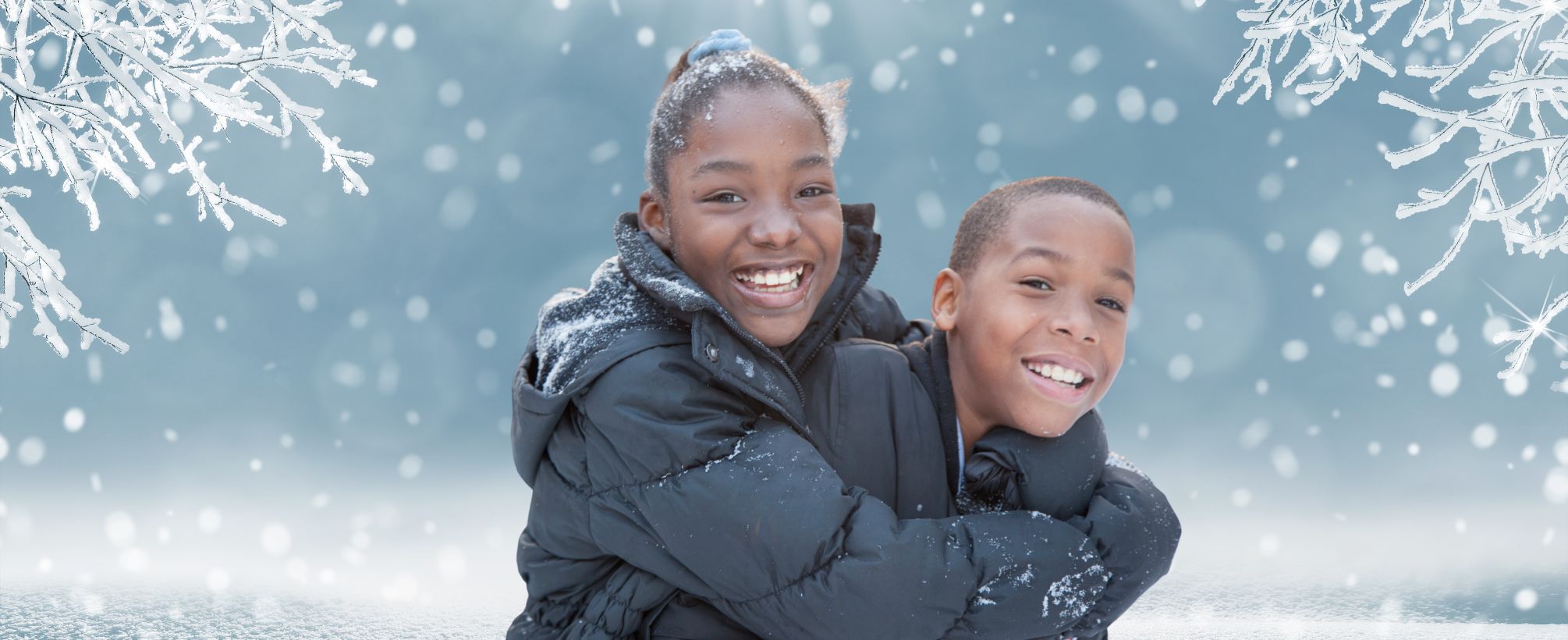 An image with two kids hugging each other and smiling, the background is blue with snow.