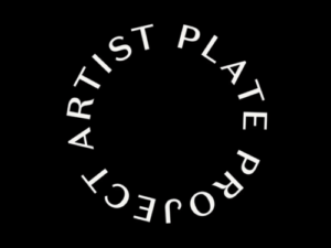A black background with white text that reads: "Artist Plate Project."