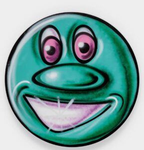 A circular design featuring a comically exaggerated face. With bulging eyes, a wide mouth, and vibrant colors, it exudes a sense of whimsy and fun.