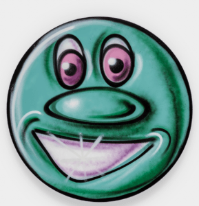 A smiling green animated face.
