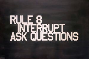 Black background with white block text that reads, "Rule 8, Interrupt, Ask Questions."